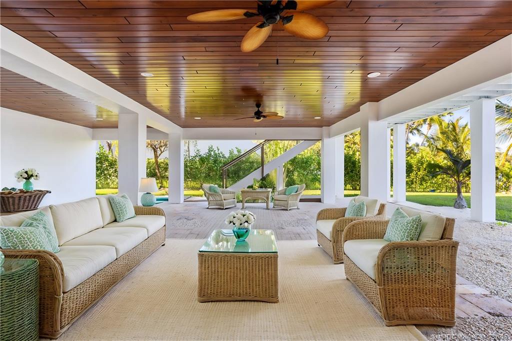 10 South Sewalls Point Road Stuart, FL 34996 - Photo 25 of 79 a living room with furniture and a large window
