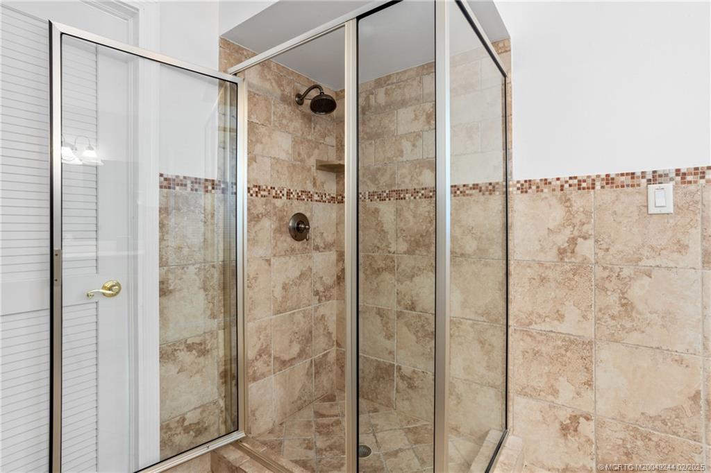 10 South Sewalls Point Road Stuart, FL 34996 - Photo 41 of 79 a bathroom with a shower and a sink