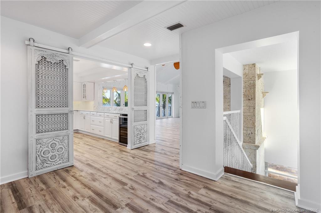 10 South Sewalls Point Road Stuart, FL 34996 - Photo 60 of 79 a open kitchen with cabinets and wooden floor