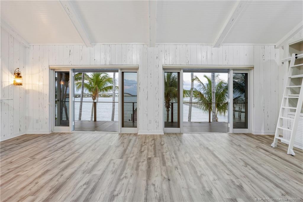 10 South Sewalls Point Road Stuart, FL 34996 - Photo 61 of 79 a view of a room with wooden floor and windows