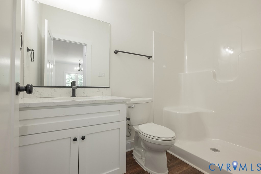 3844 Maidens Road Powhatan, VA 23139 - Photo 25 of 49 Bathroom with a shower stall, vanity, dark wood-ty