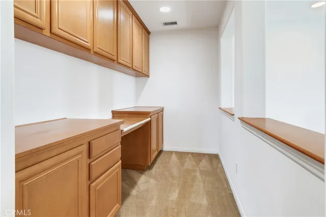a view of storage and utility room with washer and dryer