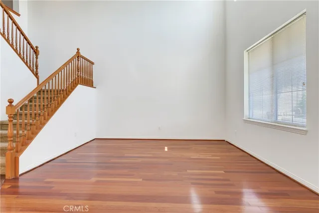 a view of an entryway with wooden floor