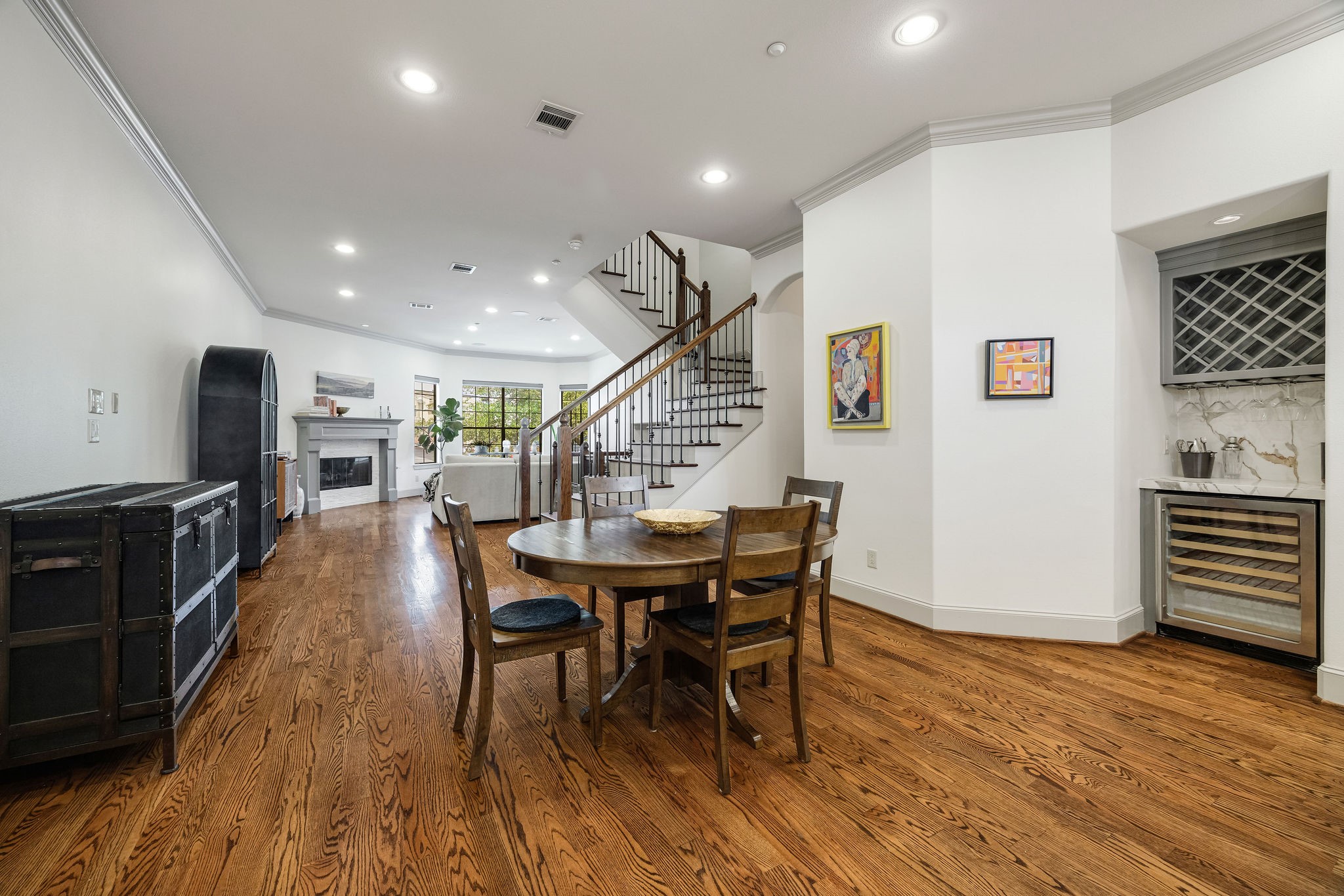 2415 Commonwealth Street Houston, TX 77006 - Photo 13 of 26 Thoughtfully designed for today's lifestyle, the expansive second-floor living spaces blend elegance and functionality, offering a seamless flow from the dining area to the chef's kitchen and into the inviting living room.