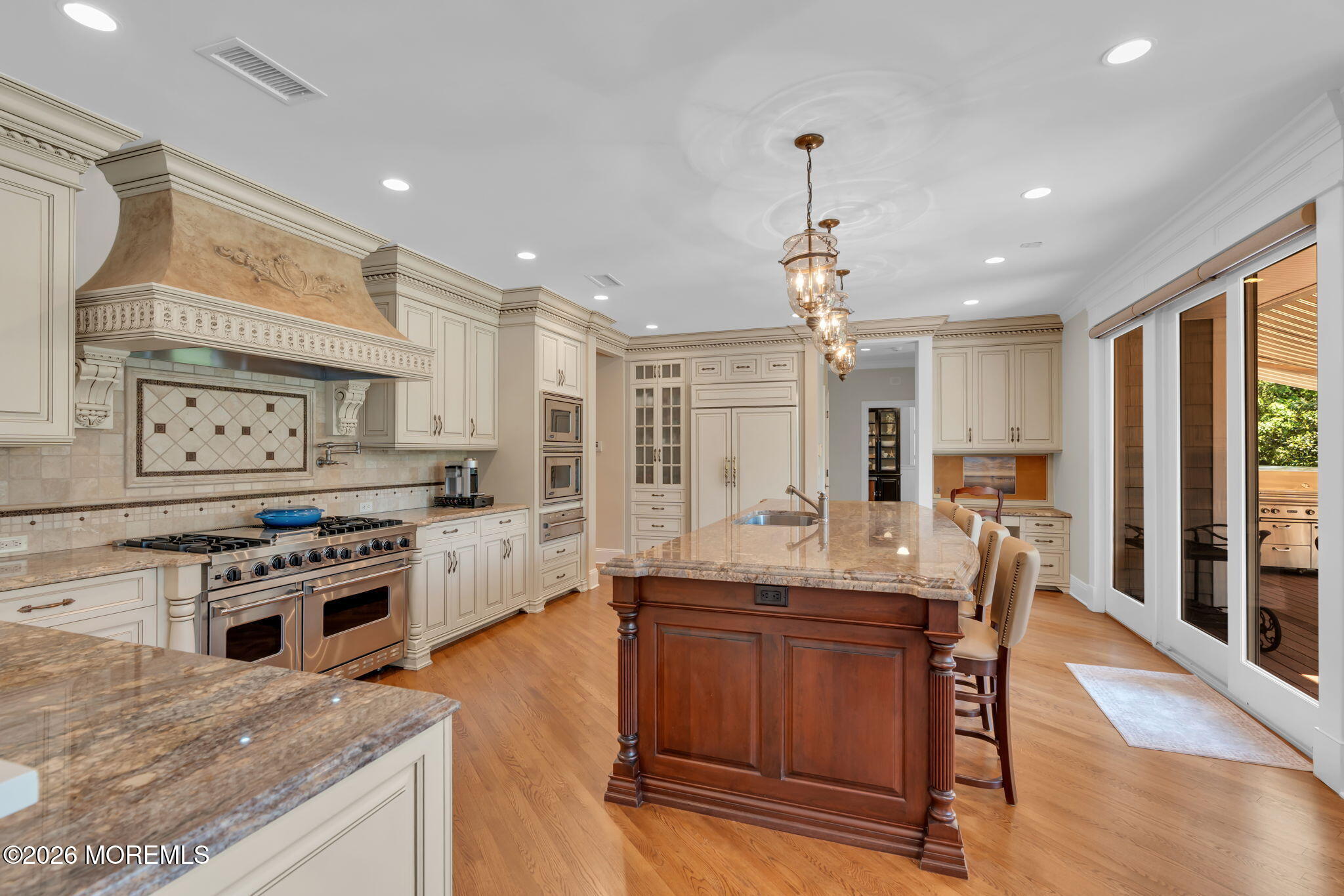 672 Winding River Road Brick, NJ 08724 - Photo 26 of 111 a kitchen with stainless steel appliances granite countertop a stove oven and a refrigerator