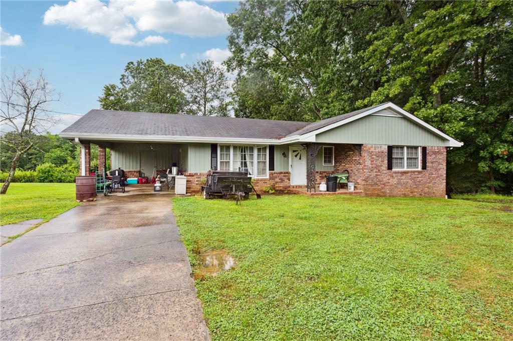 a front view of a house with a yard