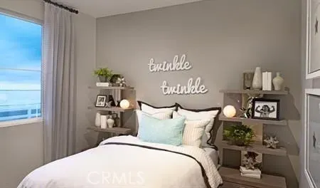 a bedroom with a bed and a table in it