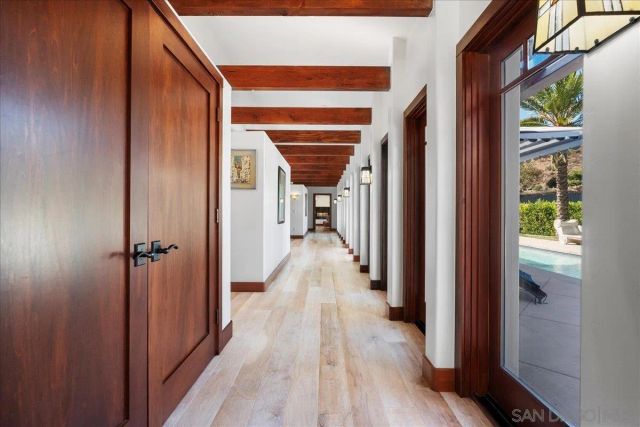 a en suite bathroom with a granite countertop sink a mirror and a