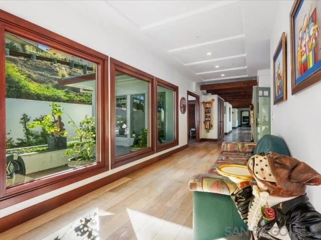 a spacious bathroom with a double vanity sink large mirror and a bathtub