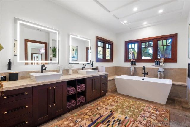 a view of swimming pool with outdoor seating and a lots of potted plants