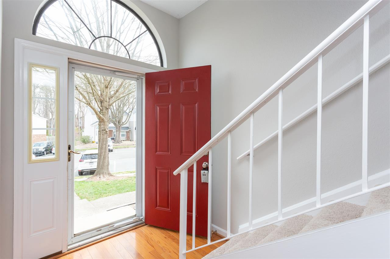 7812 Falcon Rest Circle Raleigh, NC 27615 - Photo 3 of 26 Bright Foyer with Hardwoods and Half-Round Window