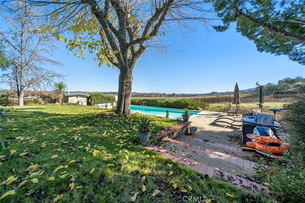 a view of swimming pool with a patio