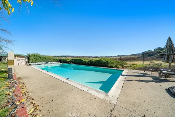 a view of a patio with swimming pool