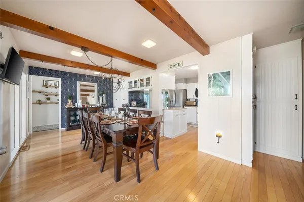 a view of a dining room with furniture window and outside view