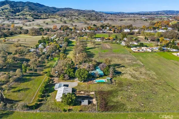 an aerial view of residential house with outdoor space and river