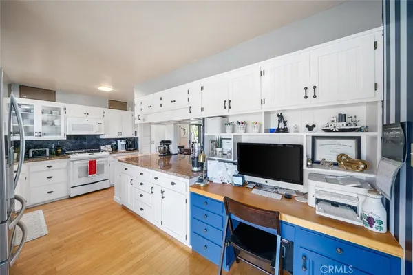 a view of a kitchen and dining room