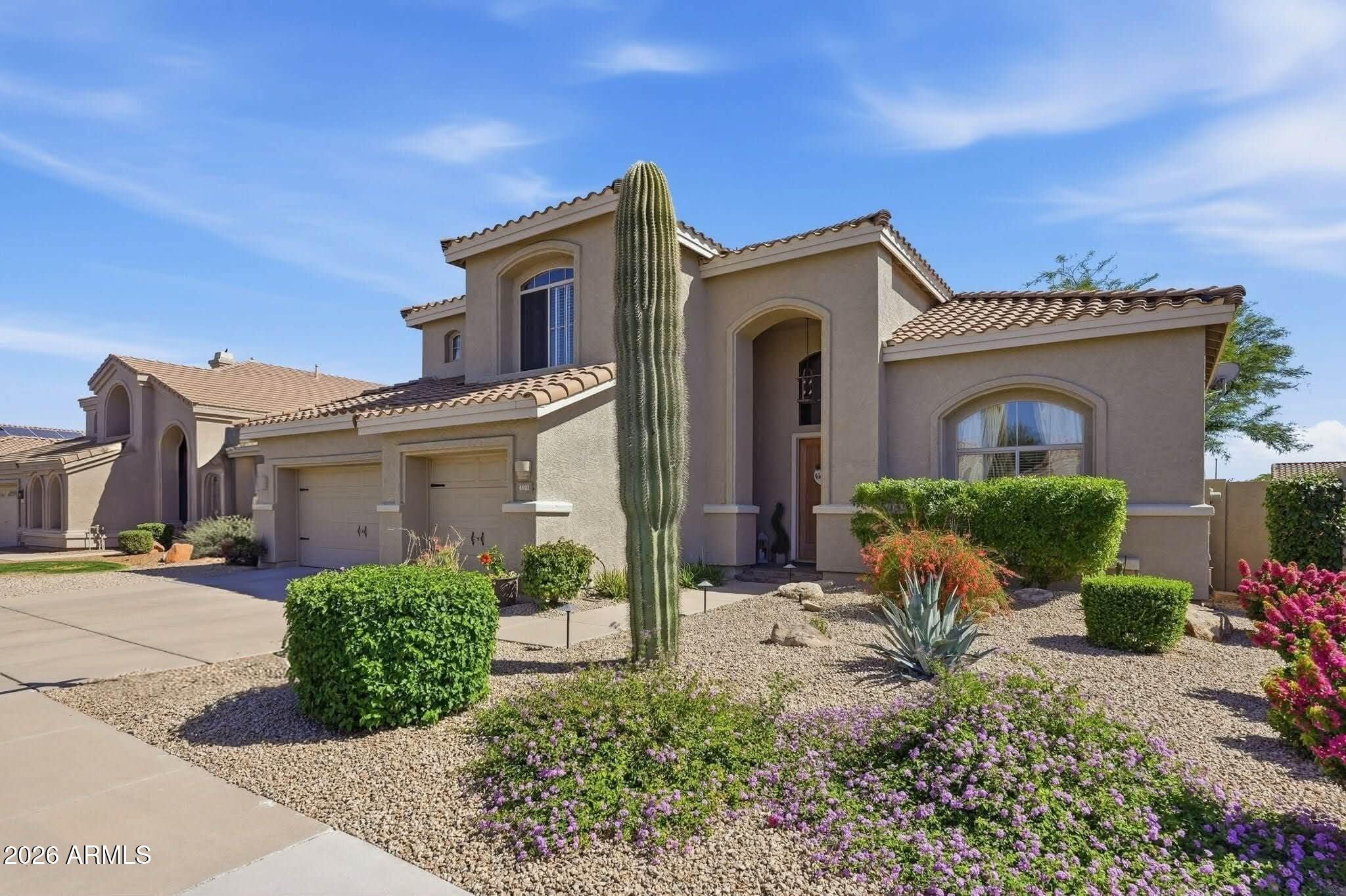4021 East Kirkland Road Phoenix, AZ 85050 - Photo 1 of 35 a front view of a house with garden