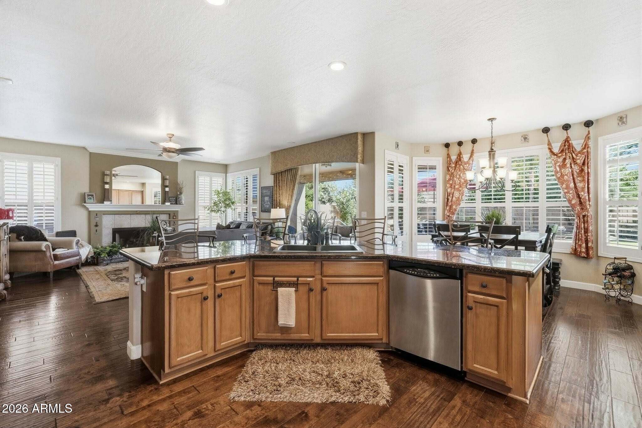 4021 East Kirkland Road Phoenix, AZ 85050 - Photo 11 of 35 a kitchen with lots of counter top space and wooden floor