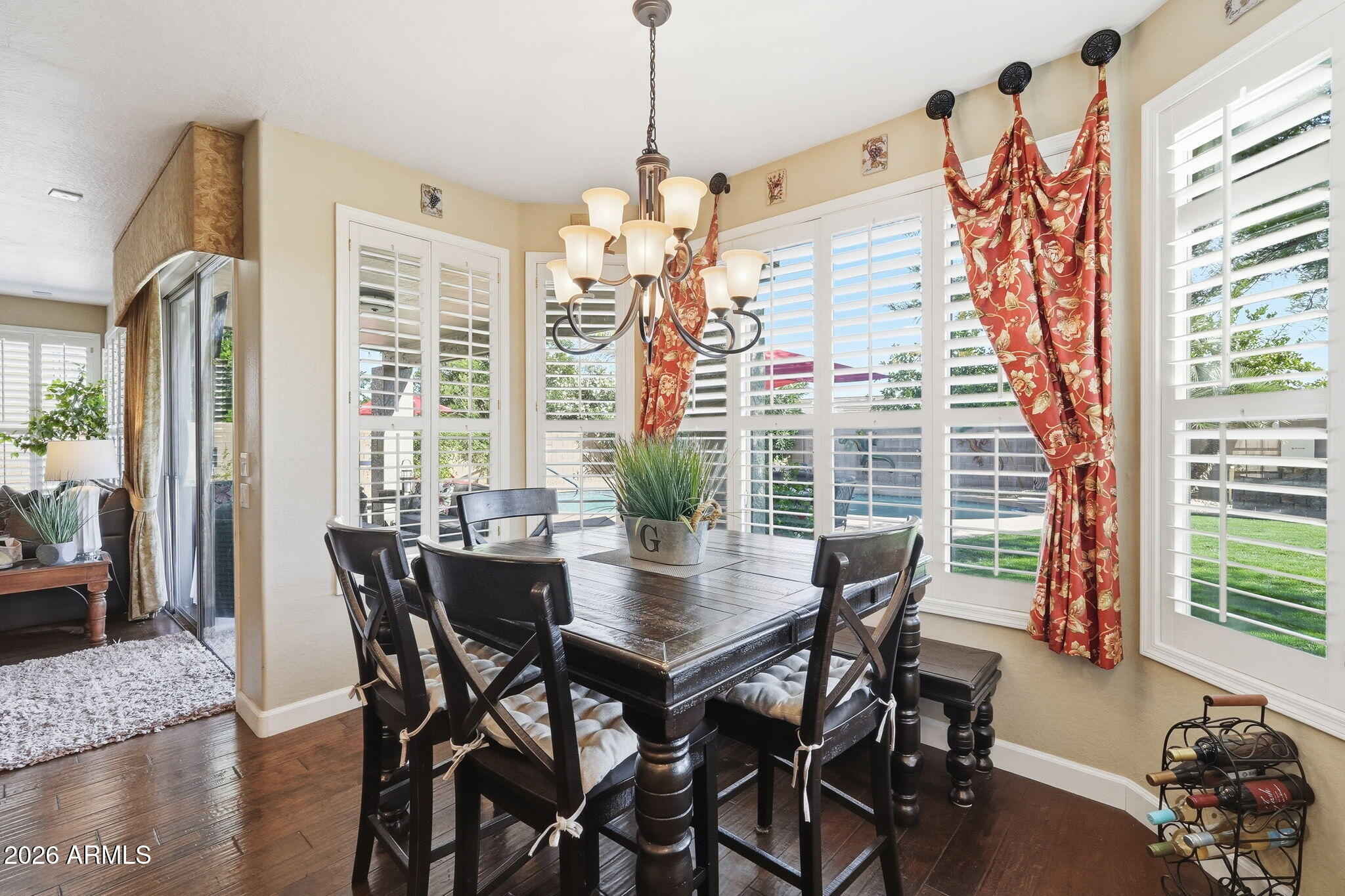 4021 East Kirkland Road Phoenix, AZ 85050 - Photo 12 of 35 a view of a dining room with furniture window and wooden floor