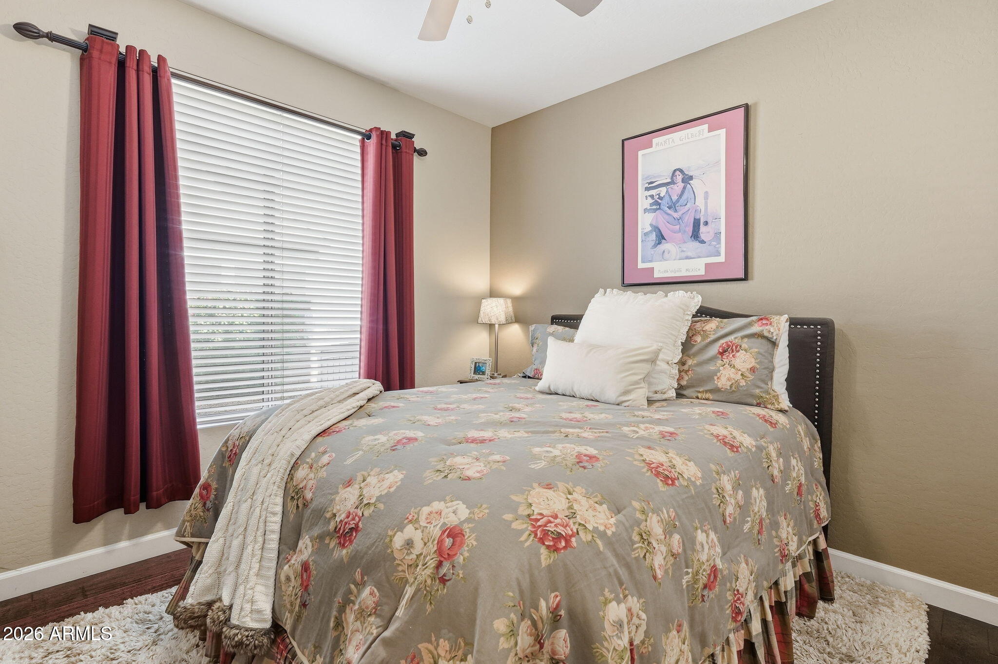 4021 East Kirkland Road Phoenix, AZ 85050 - Photo 14 of 35 a large bed sitting in a bedroom next to a window