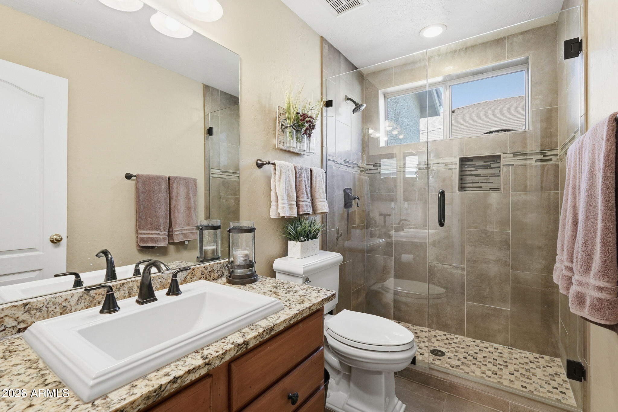 4021 East Kirkland Road Phoenix, AZ 85050 - Photo 15 of 35 a bathroom with a sink toilet and shower