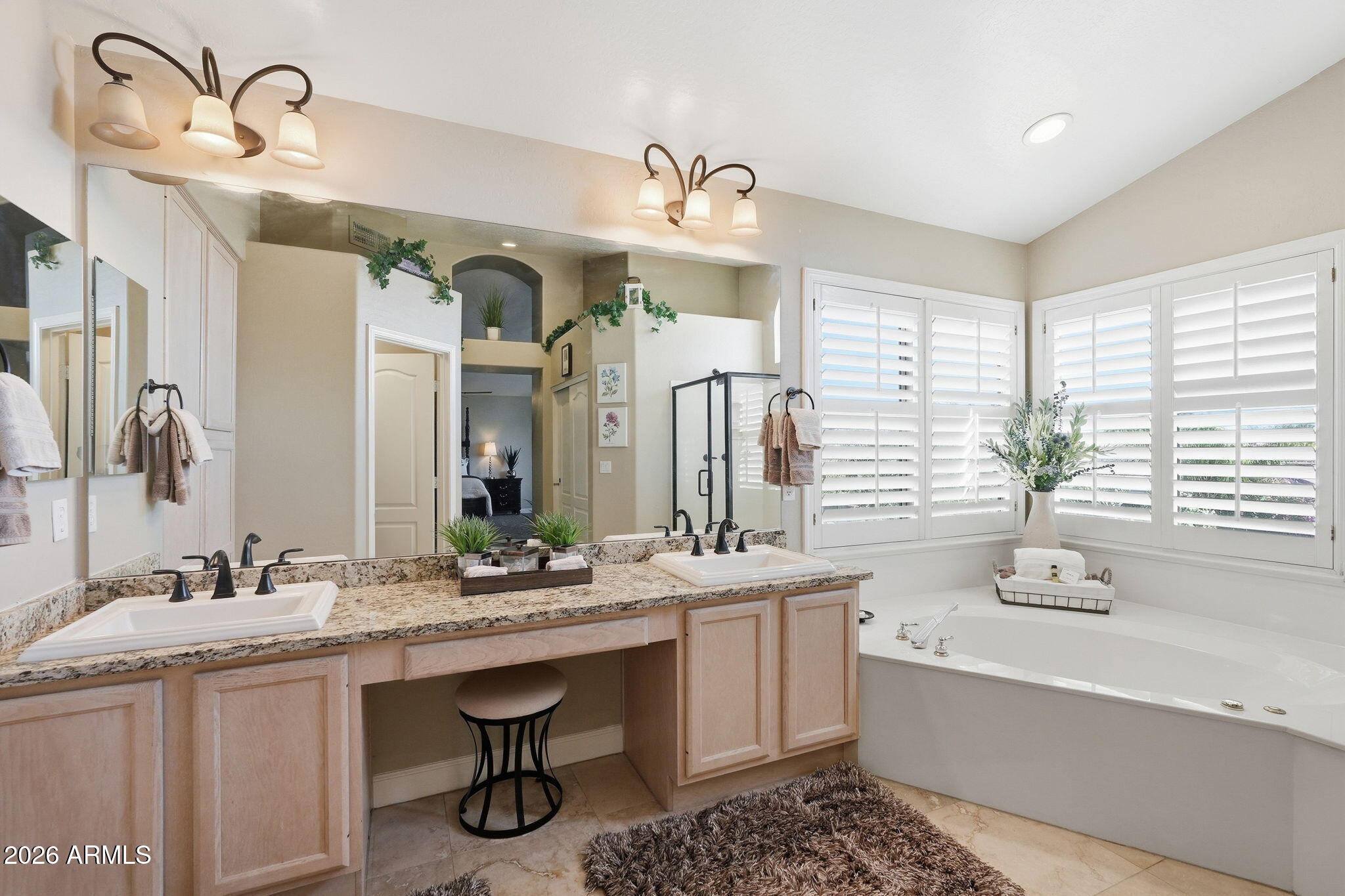 4021 East Kirkland Road Phoenix, AZ 85050 - Photo 19 of 35 a bathroom with a sink double vanity granite tub and a large mirror