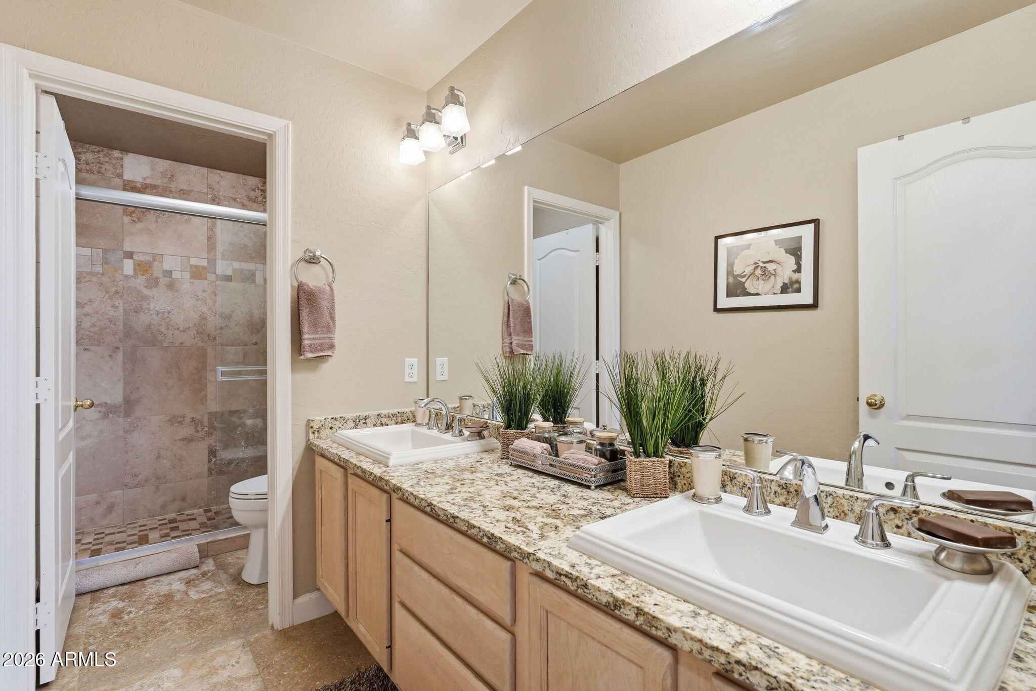 4021 East Kirkland Road Phoenix, AZ 85050 - Photo 24 of 35 a bathroom with a double vanity sink toilet and shower