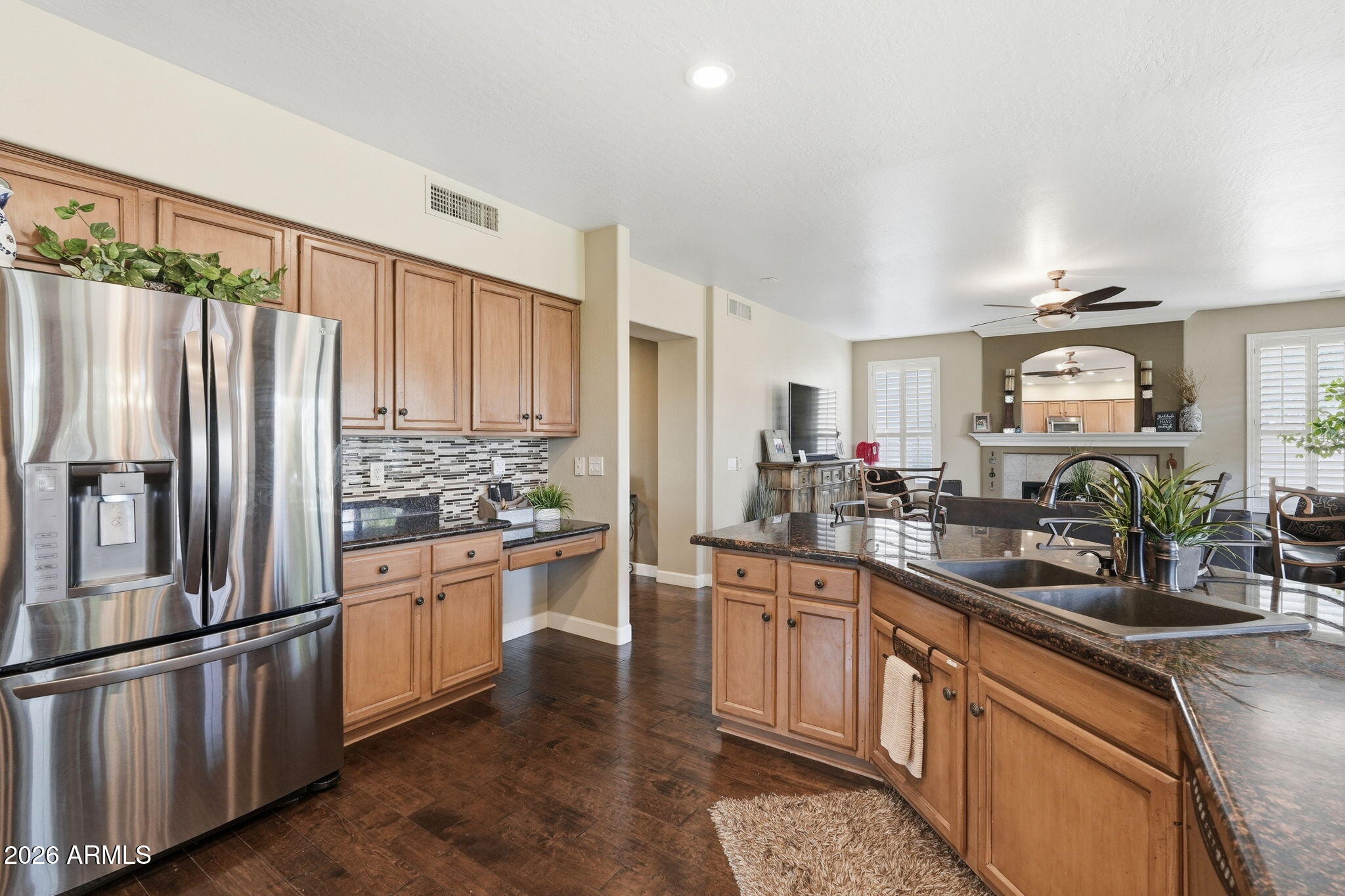 4021 East Kirkland Road Phoenix, AZ 85050 - Photo 10 of 35 a kitchen with stainless steel appliances granite countertop a refrigerator sink and cabinets