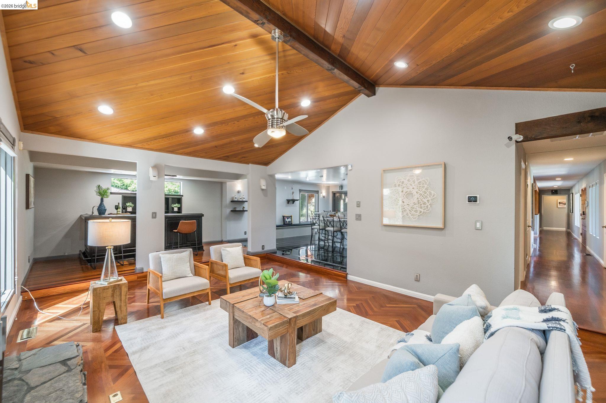 11133 Golf Links Road Oakland, CA 94605 - Photo 20 of 57 Vaulted wood-paneled ceiling with exposed beam, recessed lighting, and a ceiling fan