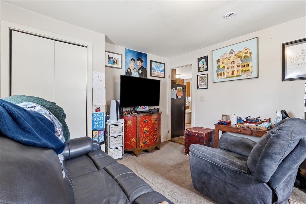 22 Gilboa Street Douglas, MA 01516 - Photo 12 of 21 a living room with furniture and a flat screen tv