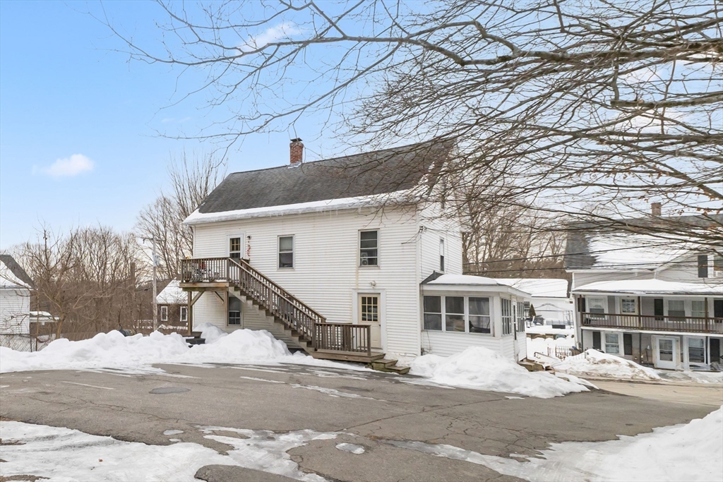 22 Gilboa Street Douglas, MA 01516 - Photo 5 of 21 a view of a house with a snow in the road
