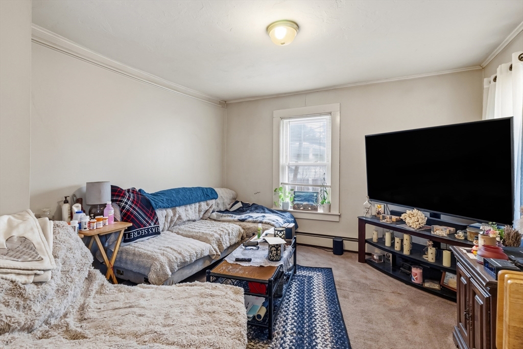 22 Gilboa Street Douglas, MA 01516 - Photo 6 of 21 a living room with furniture and a flat screen tv