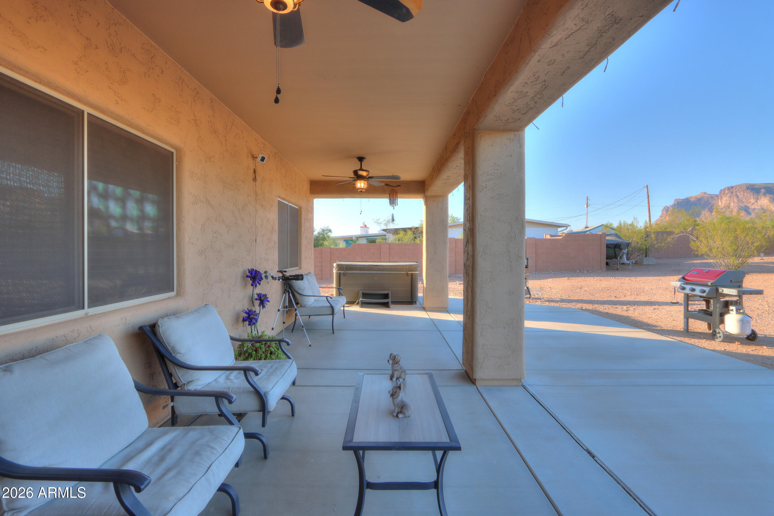 1487 South Mountain View Road Apache Junction, AZ 85119 - Photo 28 of 60 a living room with furniture and a large window