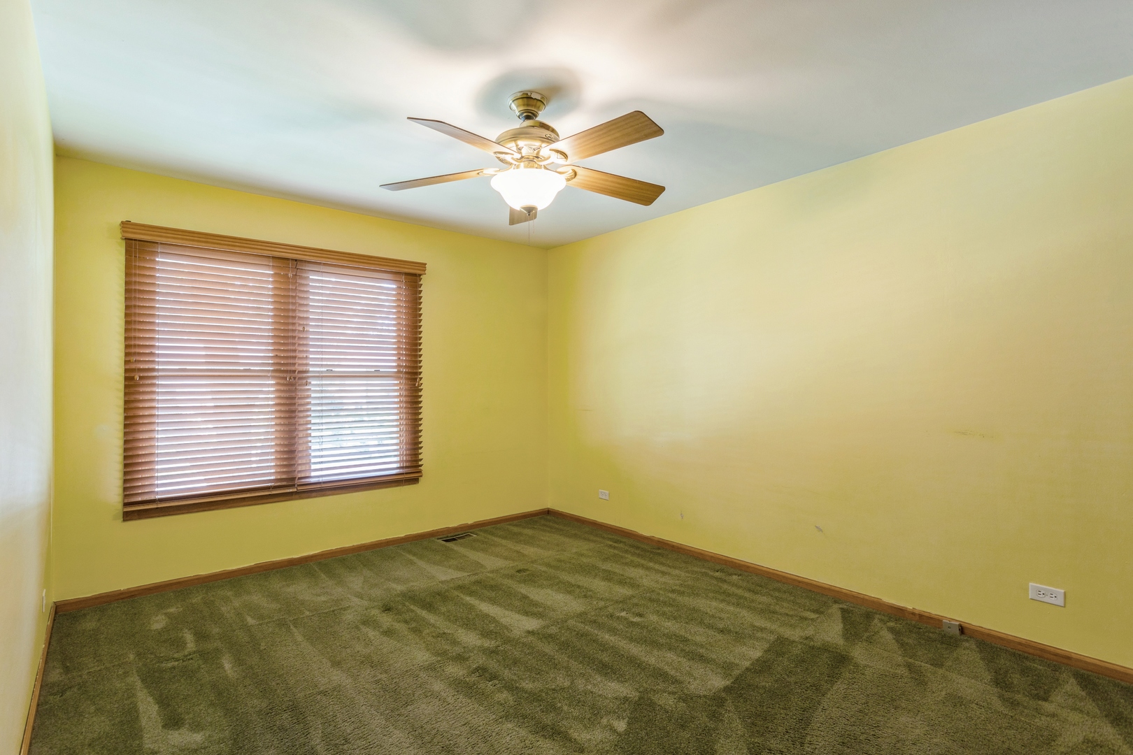628 West Briarcliff Road Bolingbrook, IL 60440 - Photo 11 of 31 a view of an empty room and window