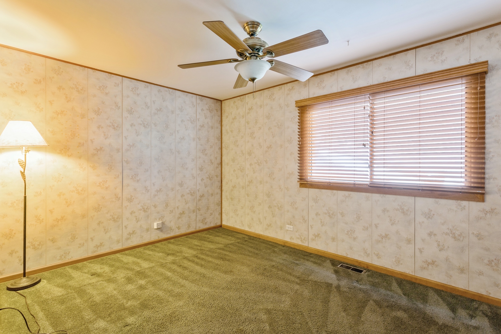 628 West Briarcliff Road Bolingbrook, IL 60440 - Photo 14 of 31 a view of a room with a ceiling fan and a window