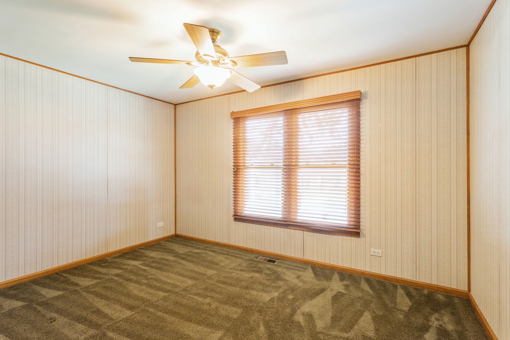 628 West Briarcliff Road Bolingbrook, IL 60440 - Photo 16 of 31 a view of an empty room with a window