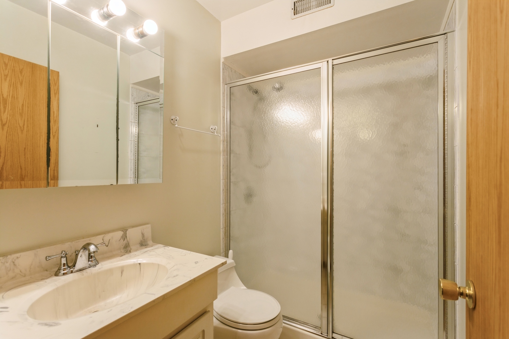 628 West Briarcliff Road Bolingbrook, IL 60440 - Photo 18 of 31 a bathroom with a sink toilet and shower