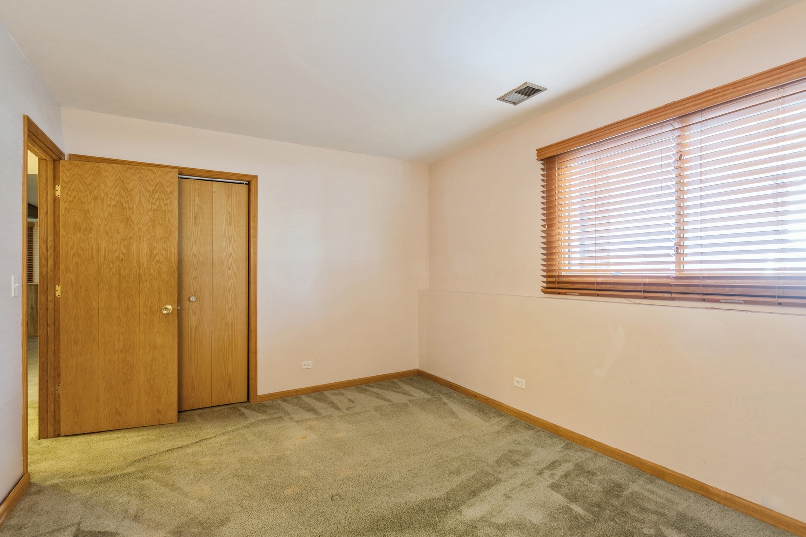 628 West Briarcliff Road Bolingbrook, IL 60440 - Photo 24 of 31 a view of an empty room with a window