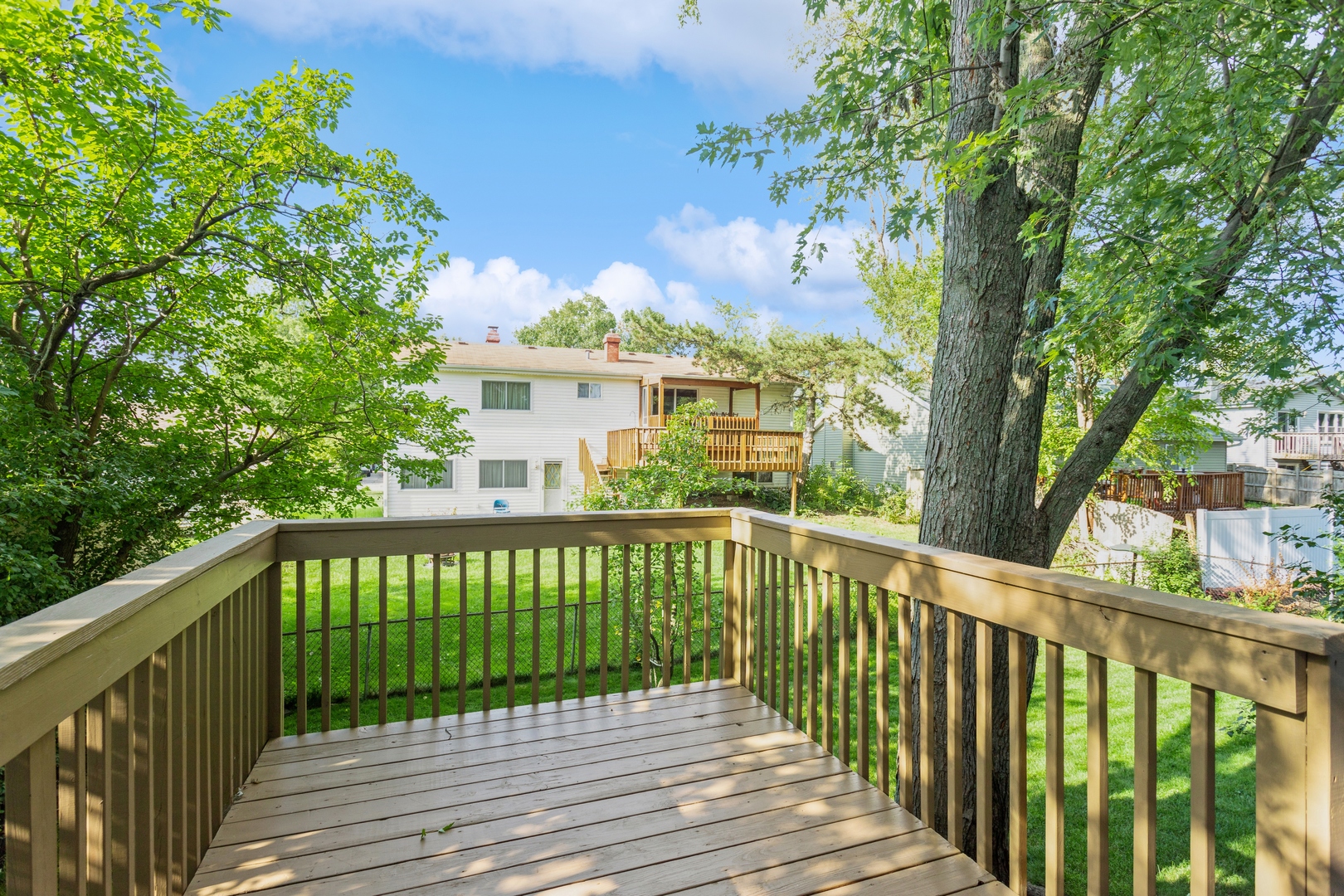 628 West Briarcliff Road Bolingbrook, IL 60440 - Photo 28 of 31 a view of a wooden roof deck