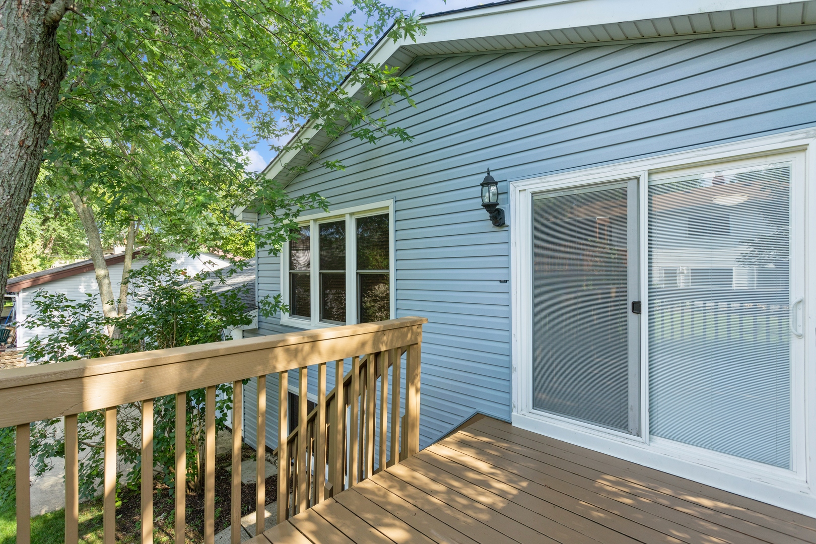 628 West Briarcliff Road Bolingbrook, IL 60440 - Photo 29 of 31 a view of a wooden house with a large window