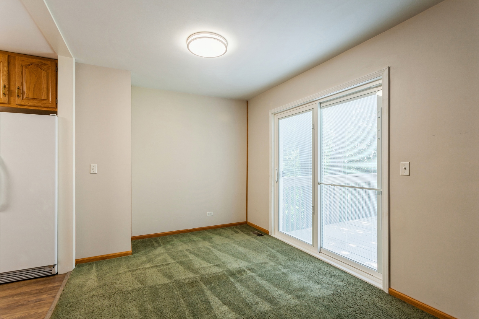 628 West Briarcliff Road Bolingbrook, IL 60440 - Photo 6 of 31 a view of an empty room and window