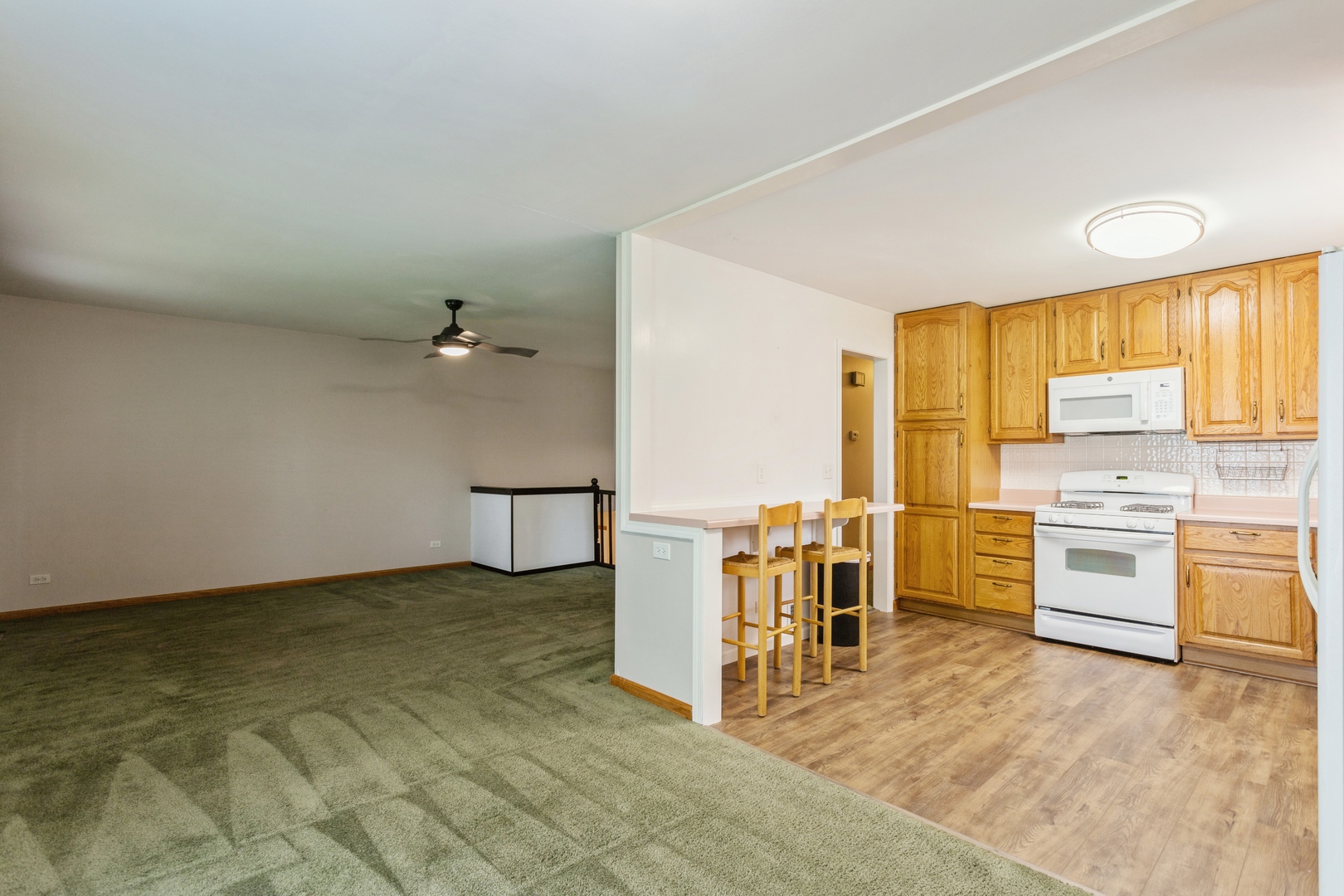 628 West Briarcliff Road Bolingbrook, IL 60440 - Photo 7 of 31 a view of a kitchen with a sink and a refrigerator