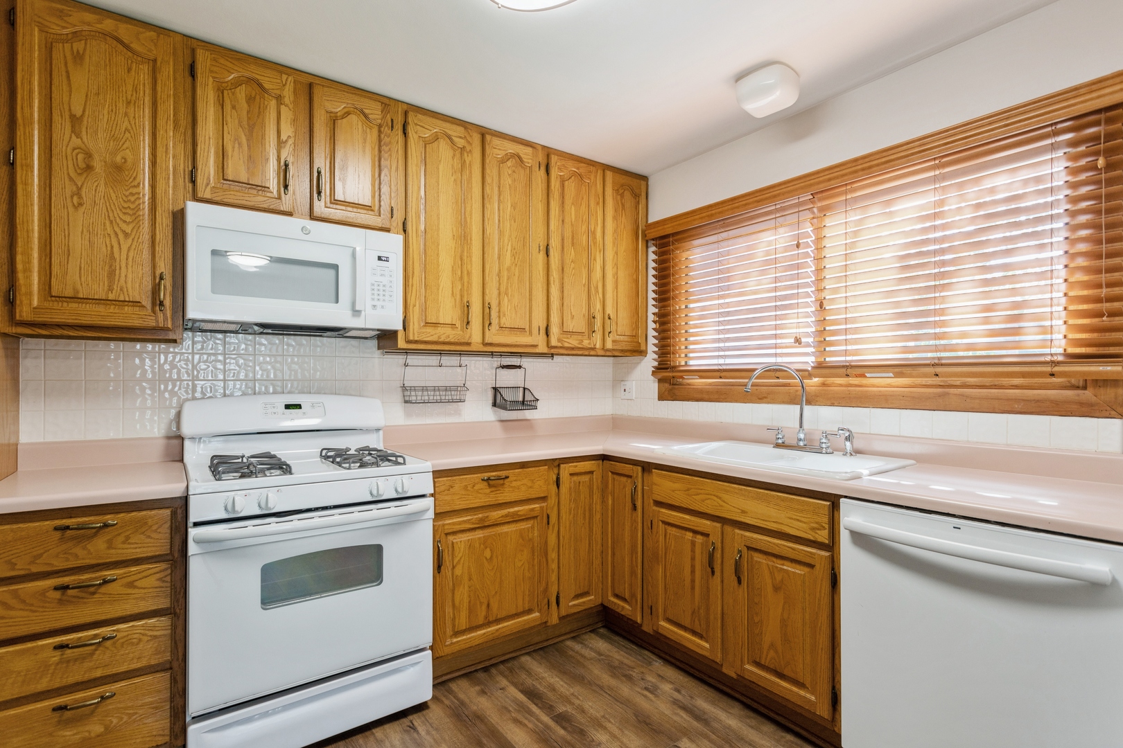 628 West Briarcliff Road Bolingbrook, IL 60440 - Photo 8 of 31 a kitchen with a sink stove top oven and cabinets
