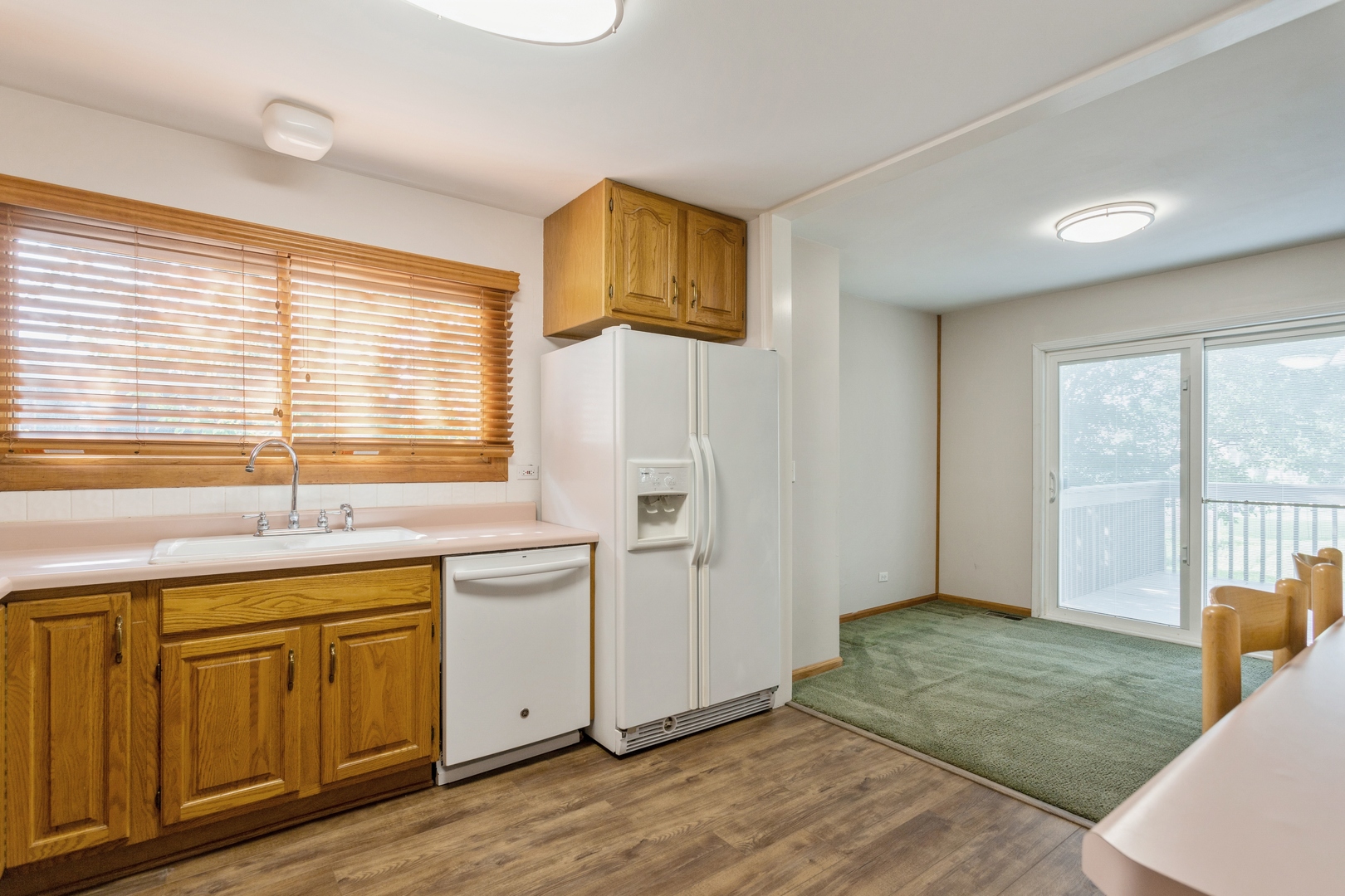 628 West Briarcliff Road Bolingbrook, IL 60440 - Photo 10 of 31 a kitchen with a sink cabinets and wooden floor