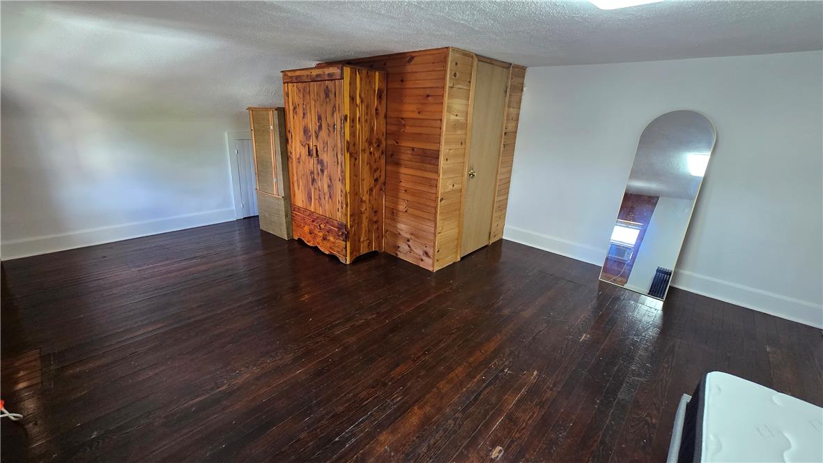 883 North Locust Street Hazleton, PA 18201 - Photo 67 of 83 Rich hardwood flooring stretches across this naturally illuminated, versatile room.