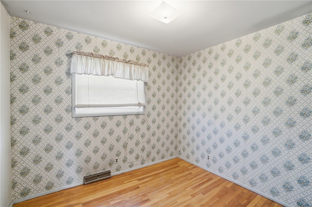 1087 Fairfield Road Troy, OH 45373 - Photo 21 of 39 This spacious room features hardwood floors and ample natural light, ideal for comfortable living.