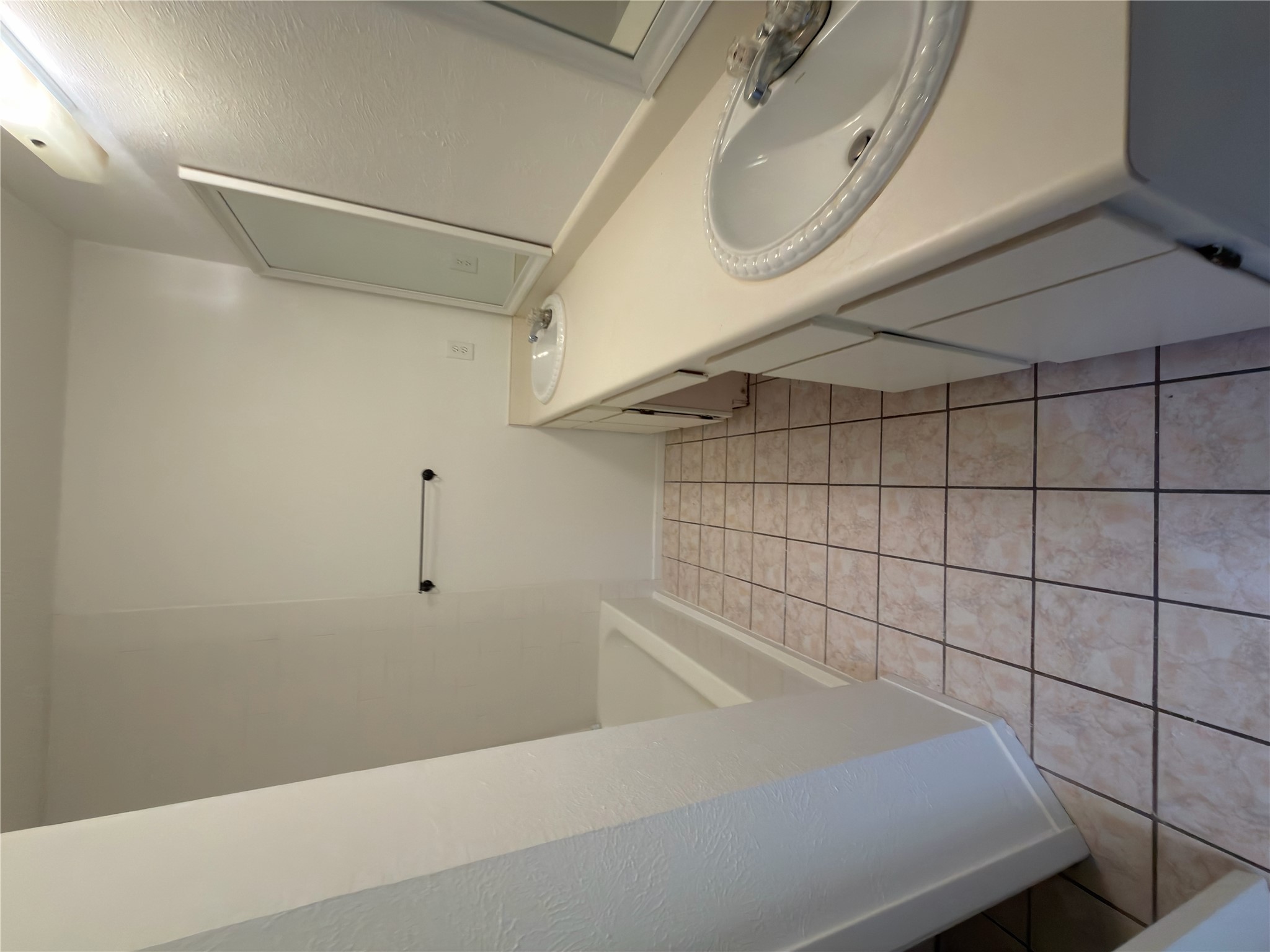 5601 Porsche Lane Austin, TX 78749 - Photo 11 of 38 a bathroom with a sink and a mirror