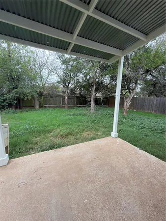 a view of a back yard with green space