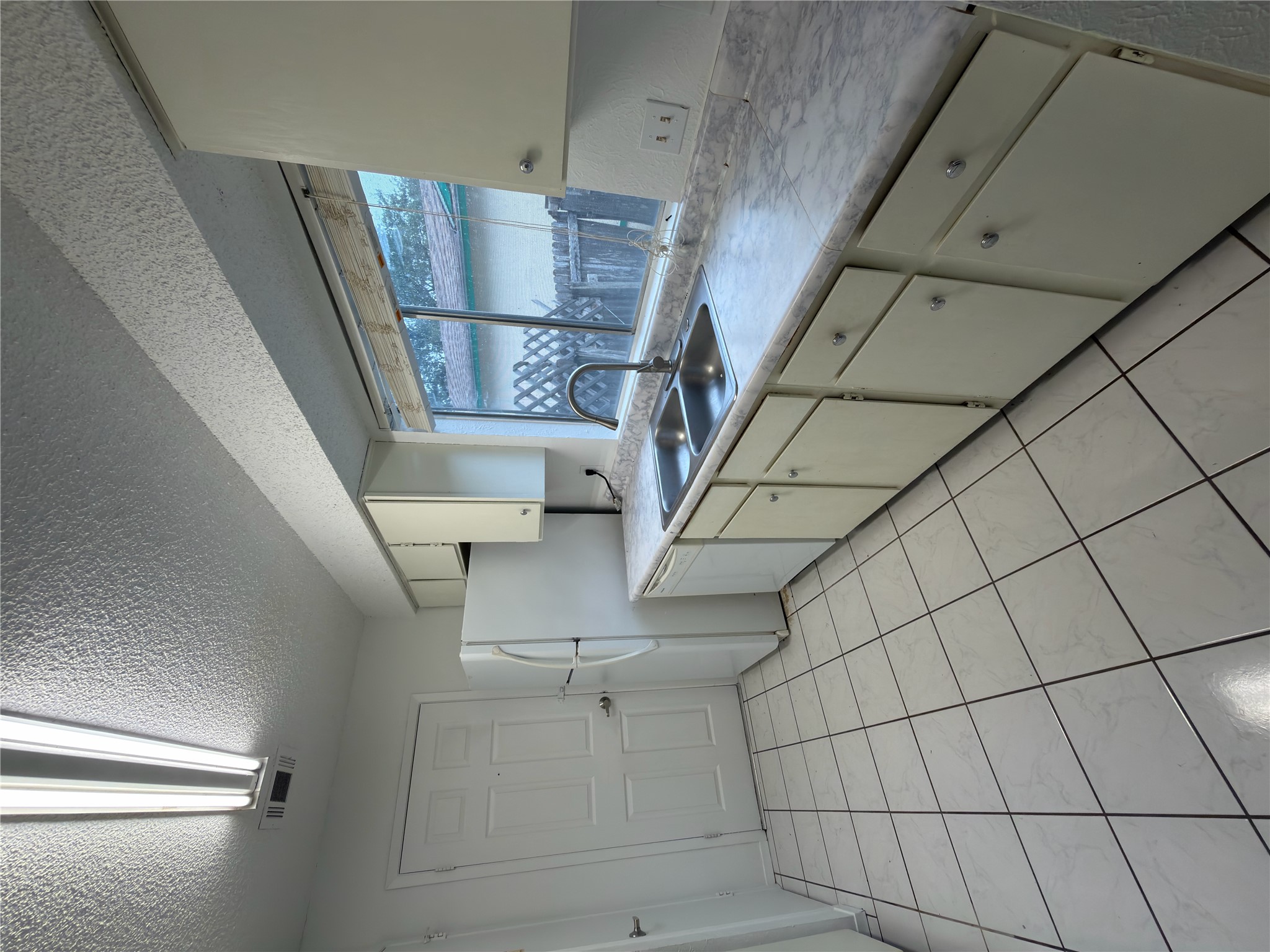 5601 Porsche Lane Austin, TX 78749 - Photo 2 of 38 a kitchen with a sink and cabinets