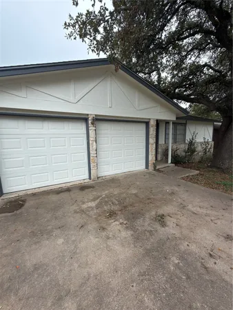 a view of garage and yard